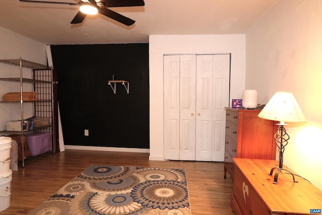 5254 Havenwood Ln, Schuyler, VA 22969 - bedroom featuring wood finished floors, a closet, ceiling fan, and baseboards
