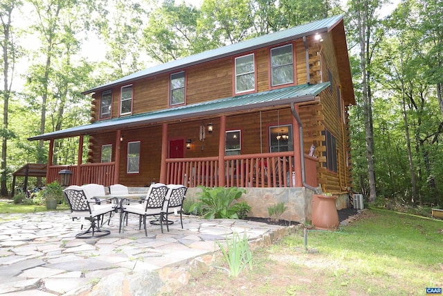 5254 Havenwood Ln, Schuyler, VA 22969 - log cabin featuring log exterior, metal roof, a porch, central AC, and a patio