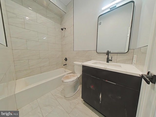 3143 W Montgomery Ave, Philadelphia, PA 19121 - bathroom featuring toilet, vanity, shower / tub combination, marble finish floors, and tile walls