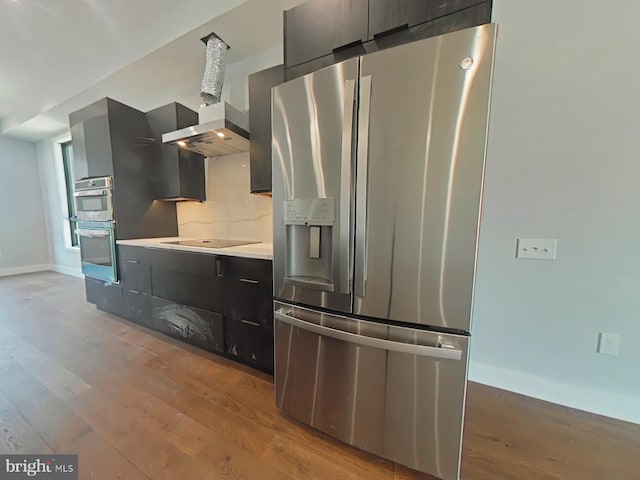 3143 W Montgomery Ave, Philadelphia, PA 19121 - kitchen featuring stainless steel appliances, light wood-type flooring, baseboards, and light countertops