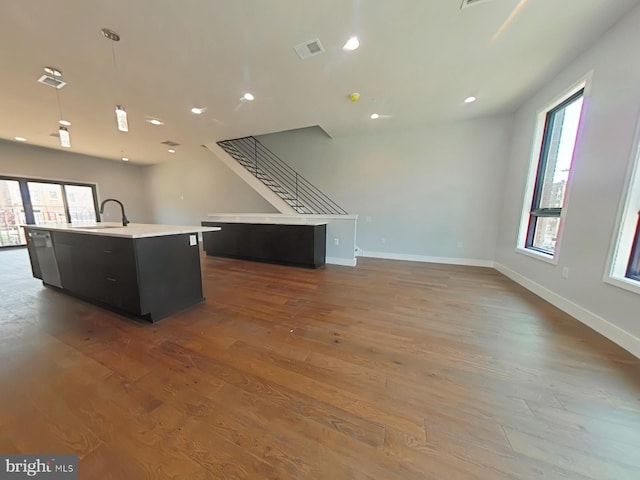 3143 W Montgomery Ave, Philadelphia, PA 19121 - kitchen featuring open floor plan, a kitchen island with sink, healthy amount of natural light, wood finished floors, and recessed lighting