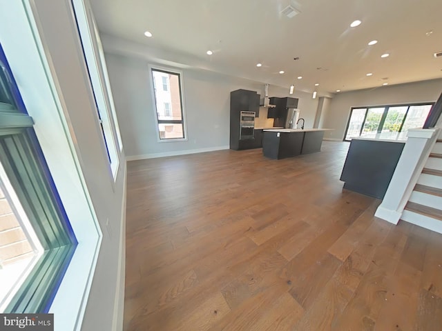 3143 W Montgomery Ave, Philadelphia, PA 19121 - unfurnished living room with recessed lighting, wood finished floors, and baseboards