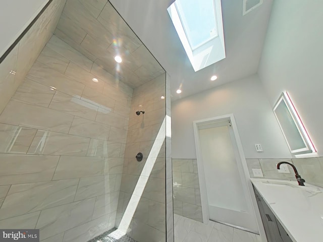 3143 W Montgomery Ave, Philadelphia, PA 19121 - full bath with a skylight, a tile shower, vanity, and recessed lighting