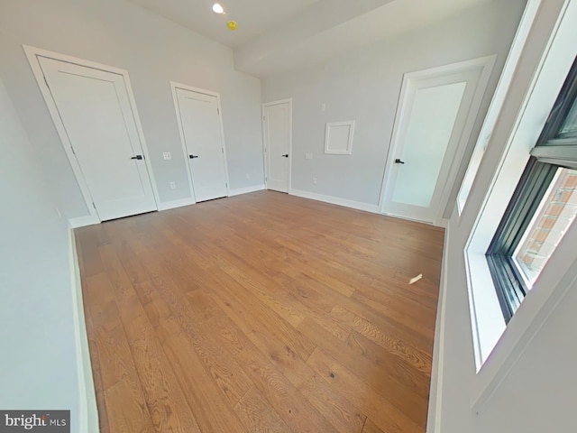 3143 W Montgomery Ave, Philadelphia, PA 19121 - unfurnished bedroom with wood finished floors, two closets, baseboards, and recessed lighting