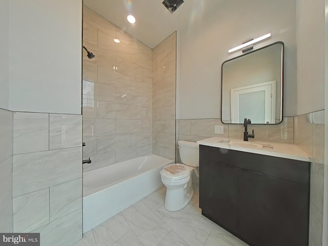 3143 W Montgomery Ave, Philadelphia, PA 19121 - bathroom with toilet, vanity, bathtub / shower combination, marble finish floors, and tile walls