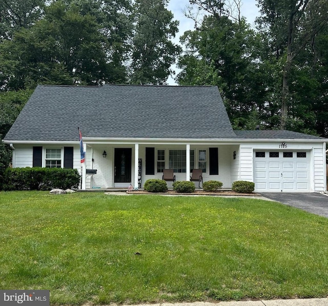 1725 Swinburne Ave, Crofton, MD 21114 - view of front of house with a porch, an attached garage, driveway, and a front yard