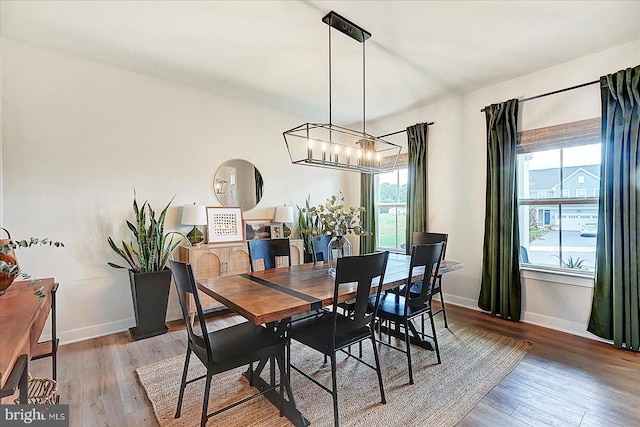 48 Winifred Dr, Hanover, PA 17331 - dining area with a chandelier, wood finished floors, and baseboards