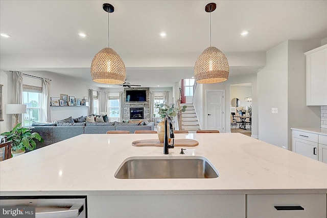 48 Winifred Dr, Hanover, PA 17331 - kitchen featuring a sink, dishwasher, a kitchen island with sink, open floor plan, and white cabinetry
