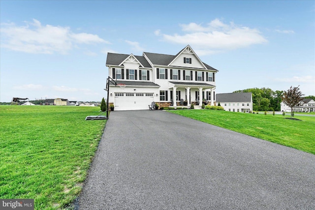 48 Winifred Dr, Hanover, PA 17331 - view of front facade featuring asphalt driveway, an attached garage, a front lawn, and covered porch