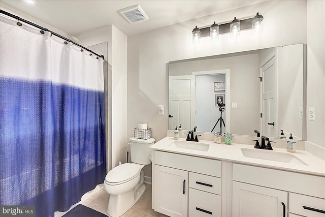 48 Winifred Dr, Hanover, PA 17331 - bathroom featuring toilet, double vanity, tile patterned flooring, and curtained shower
