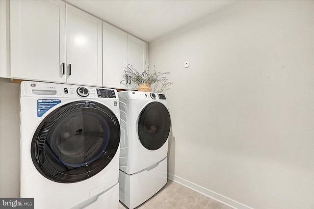 48 Winifred Dr, Hanover, PA 17331 - washroom with cabinet space, washing machine and dryer, baseboards, and light tile patterned floors