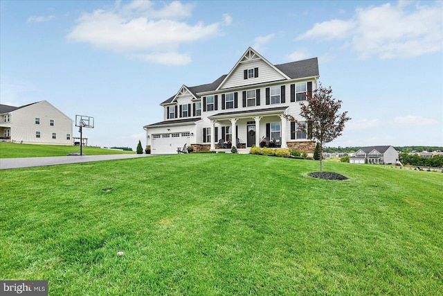 48 Winifred Dr, Hanover, PA 17331 - view of front of house with covered porch, a garage, driveway, and a front yard