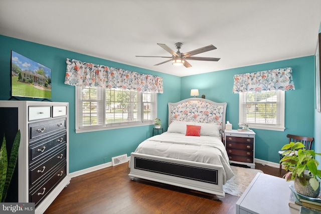 9000 Sudley Rd, Manassas, VA 20110 - bedroom with baseboards, dark wood finished floors, and ceiling fan
