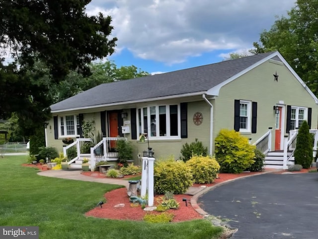9000 Sudley Rd, Manassas, VA 20110 - view of front of house featuring a front lawn and brick siding
