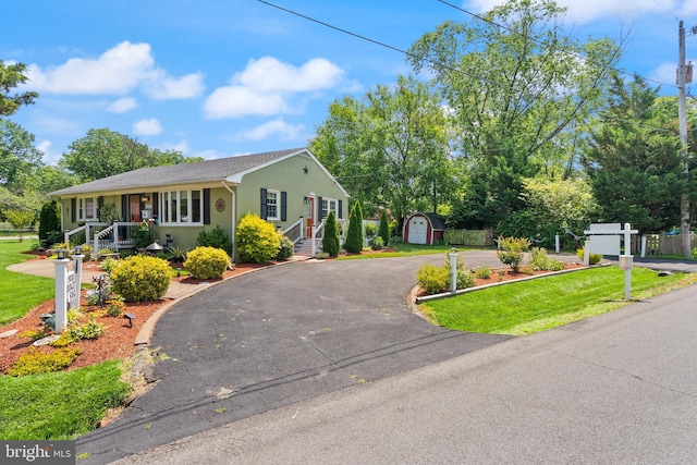 9000 Sudley Rd, Manassas, VA 20110 - view of front of home with stucco siding, driveway, and a front lawn