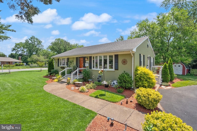9000 Sudley Rd, Manassas, VA 20110 - view of front facade featuring a front lawn, brick siding, and roof with shingles