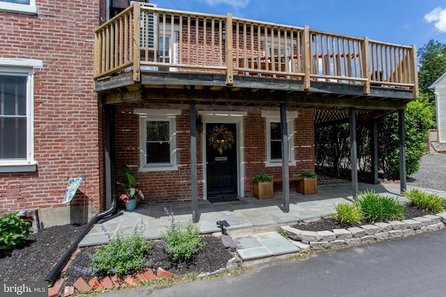 72 N Franklin St Unit A, Lambertville, NJ 08530 - property entrance with brick siding, a deck, and a patio area