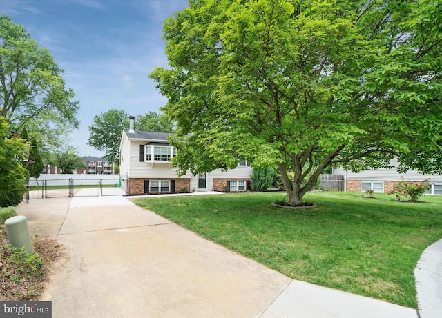 4 Hawkesbury Ct, Newark, DE 19702 - view of front of property featuring driveway, a gate, and brick siding