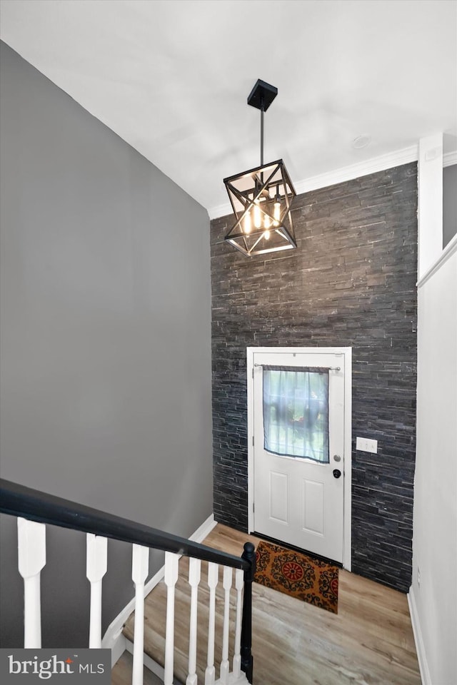 4 Hawkesbury Ct, Newark, DE 19702 - foyer featuring a chandelier, wood finished floors, stairs, baseboards, and crown molding