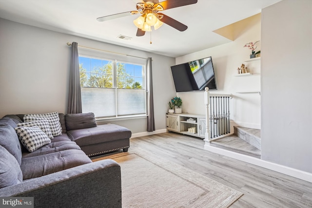 2557 Peter Jefferson Ln, Herndon, VA 20171 - living area featuring light wood-style flooring, baseboards, and ceiling fan