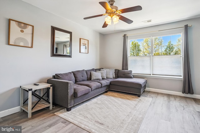 2557 Peter Jefferson Ln, Herndon, VA 20171 - living area with light wood-type flooring, a ceiling fan, and baseboards