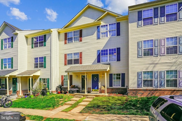 2557 Peter Jefferson Ln, Herndon, VA 20171 - view of property featuring a porch and brick siding