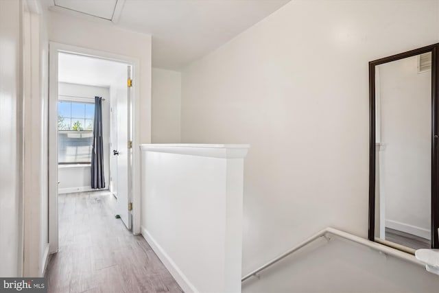 2557 Peter Jefferson Ln, Herndon, VA 20171 - corridor featuring an upstairs landing, wood finished floors, and baseboards