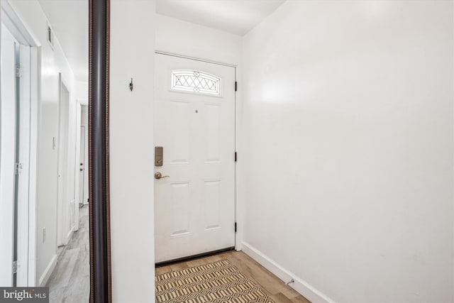 2557 Peter Jefferson Ln, Herndon, VA 20171 - doorway to outside featuring light wood-style flooring and baseboards