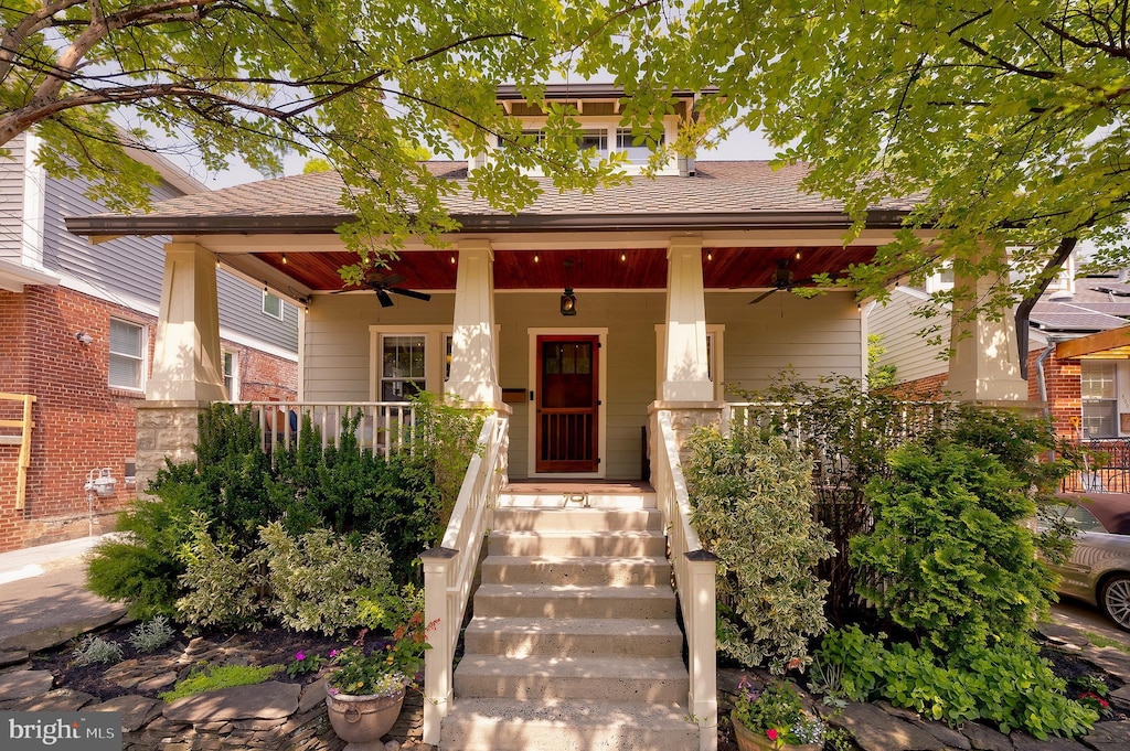 701 Little St, Alexandria, VA 22301 - view of front of home featuring ceiling fan, covered porch, a shingled roof, and brick siding