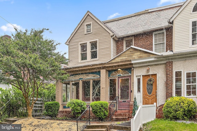 907 W Twenty Fifth St, Wilmington, DE 19802 - view of front of home with a high end roof and brick siding