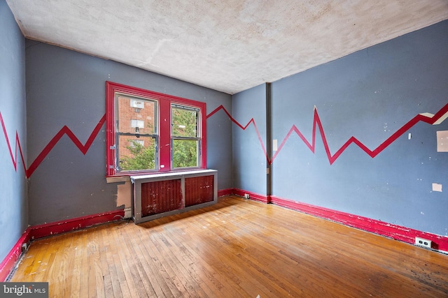 907 W Twenty Fifth St, Wilmington, DE 19802 - unfurnished room with hardwood / wood-style flooring and baseboards