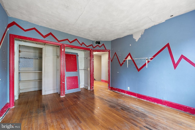 907 W Twenty Fifth St, Wilmington, DE 19802 - unfurnished bedroom with hardwood / wood-style flooring and baseboards