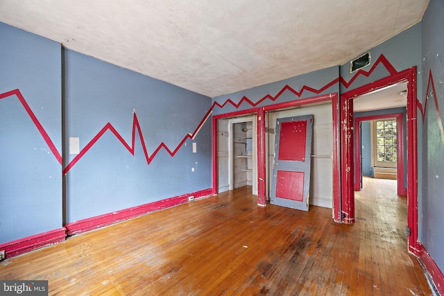 907 W Twenty Fifth St, Wilmington, DE 19802 - empty room featuring wood-type flooring and baseboards