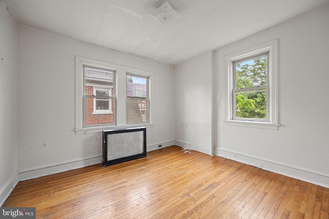 907 W Twenty Fifth St, Wilmington, DE 19802 - unfurnished room featuring light wood-style flooring, radiator heating unit, and baseboards