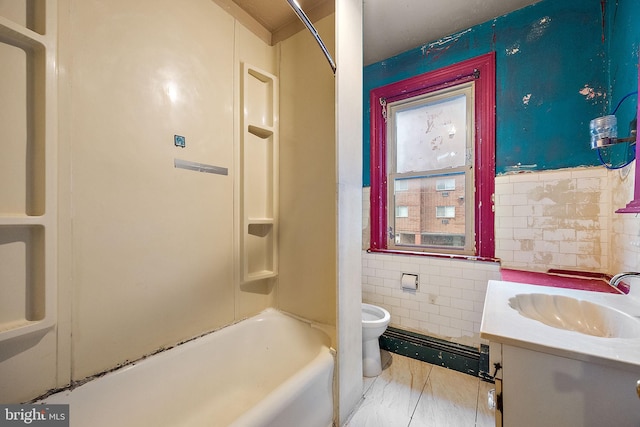 907 W Twenty Fifth St, Wilmington, DE 19802 - bathroom with tile walls, toilet, vanity, bathtub / shower combination, and marble look tile flooring
