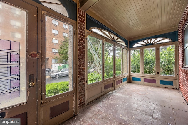 907 W Twenty Fifth St, Wilmington, DE 19802 - unfurnished sunroom with plenty of natural light, stone finish floors, and french doors