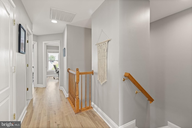504 Hollingsworth Ter, Herndon, VA 20170 - hall with an upstairs landing, light wood finished floors, baseboards, and recessed lighting