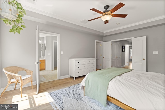 504 Hollingsworth Ter, Herndon, VA 20170 - bedroom with light wood-style floors, ornamental molding, baseboards, and a ceiling fan