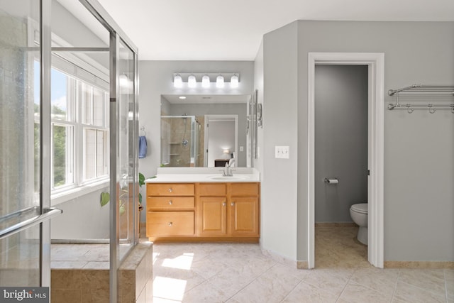 504 Hollingsworth Ter, Herndon, VA 20170 - full bath featuring vanity, a shower stall, toilet, and baseboards