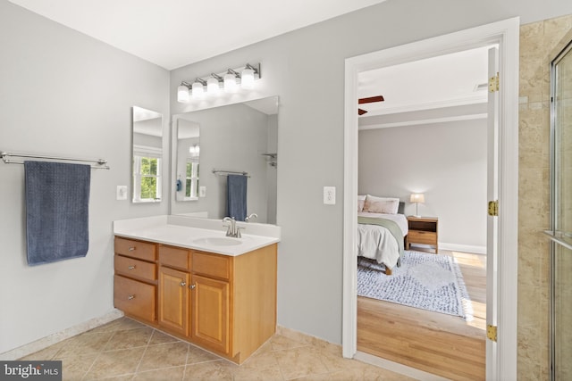 504 Hollingsworth Ter, Herndon, VA 20170 - ensuite bathroom with vanity, a tile shower, tile patterned floors, and baseboards