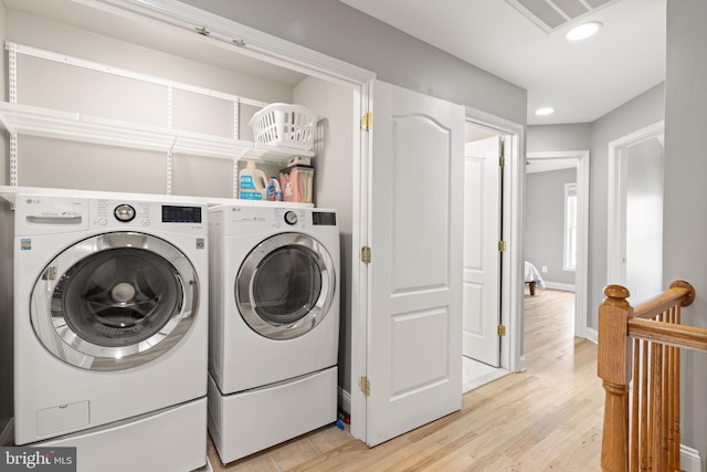 504 Hollingsworth Ter, Herndon, VA 20170 - washroom featuring washer and clothes dryer, light wood finished floors, recessed lighting, and baseboards