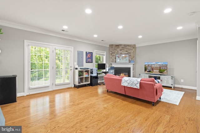 504 Hollingsworth Ter, Herndon, VA 20170 - living area with ornamental molding, wood finished floors, a fireplace, baseboards, and recessed lighting