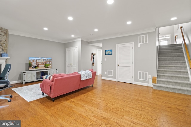 504 Hollingsworth Ter, Herndon, VA 20170 - living room with stairs, wood finished floors, recessed lighting, ornamental molding, and baseboards