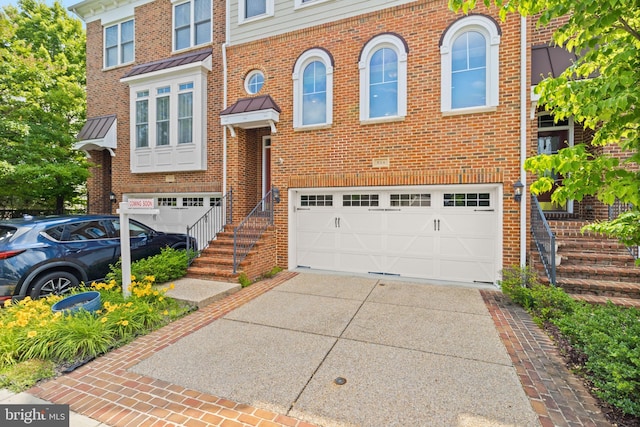 504 Hollingsworth Ter, Herndon, VA 20170 - view of front of property with a garage, concrete driveway, and brick siding