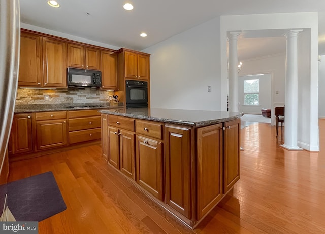 24655 Broad Creek Dr, Hollywood, MD 20636 - kitchen with black appliances, wood finished floors, brown cabinets, decorative columns, and recessed lighting