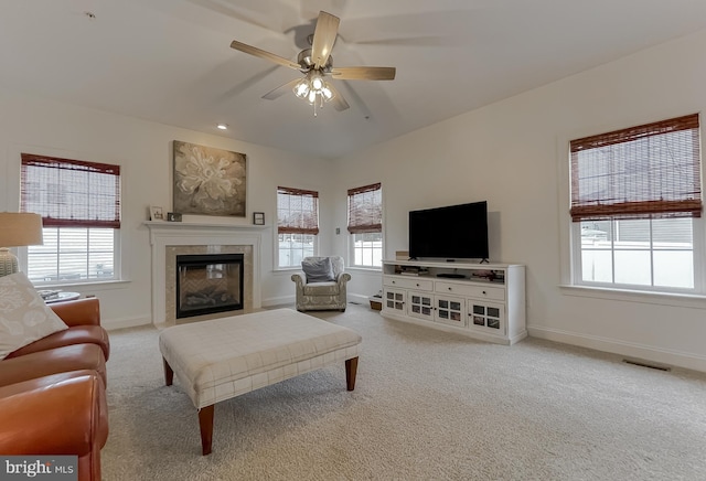 24655 Broad Creek Dr, Hollywood, MD 20636 - carpeted living room featuring baseboards, a tiled fireplace, and ceiling fan