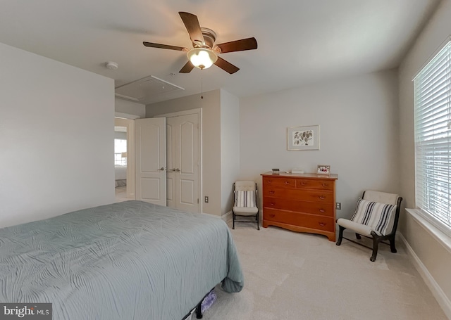 24655 Broad Creek Dr, Hollywood, MD 20636 - bedroom featuring multiple windows, attic access, light colored carpet, and a closet