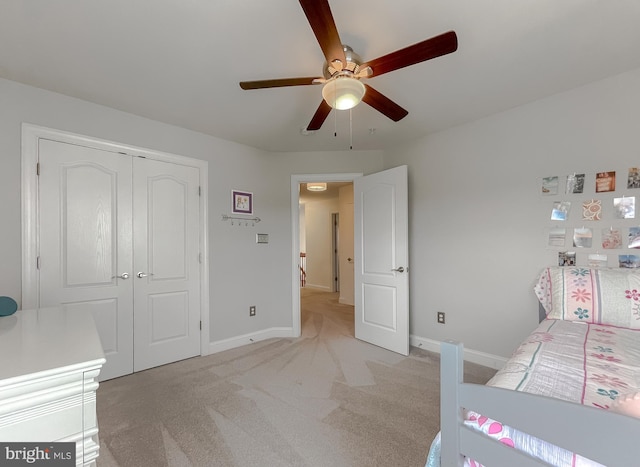 24655 Broad Creek Dr, Hollywood, MD 20636 - bedroom with baseboards, light colored carpet, a closet, and a ceiling fan