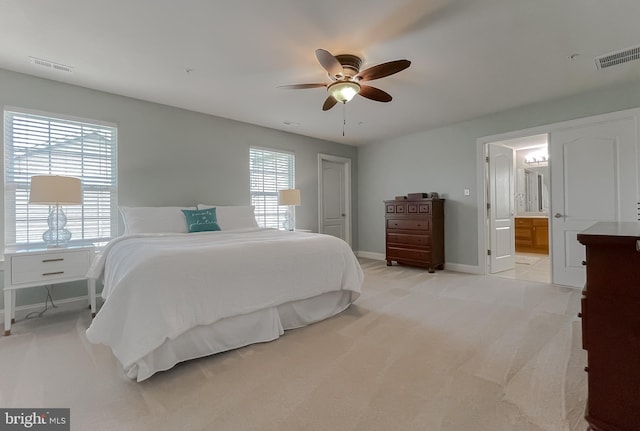 24655 Broad Creek Dr, Hollywood, MD 20636 - bedroom featuring baseboards, light carpet, a ceiling fan, and ensuite bathroom