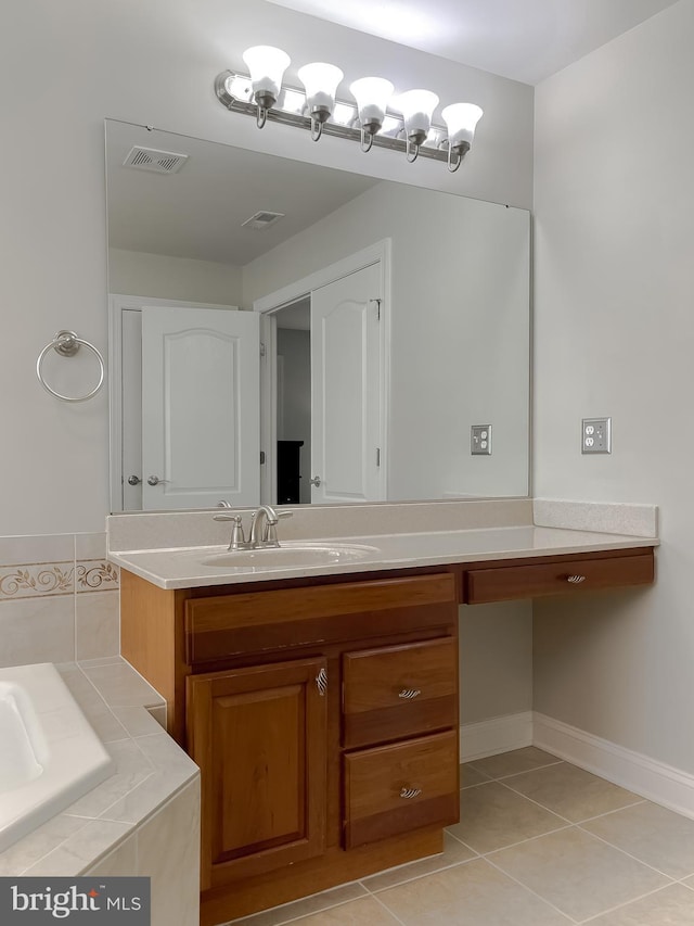 24655 Broad Creek Dr, Hollywood, MD 20636 - full bathroom featuring vanity, a garden tub, tile patterned flooring, and baseboards